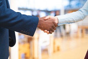 close up of two people shaking hands